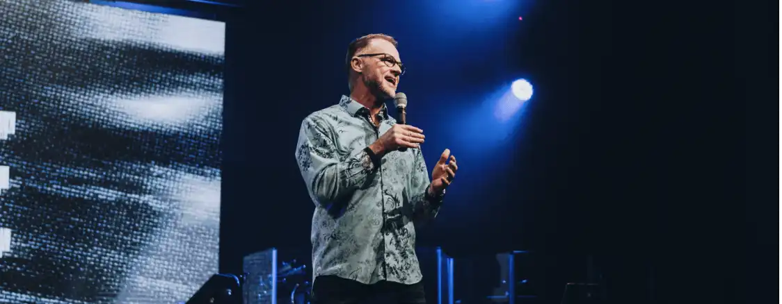 Speaker giving a talk on stage